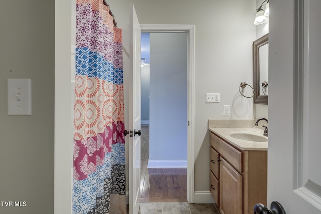 575 Boring Chapel Rd Unit 31, Johnson City, TN 37615 - bathroom featuring vanity, a shower with shower curtain, baseboards, and tile patterned flooring