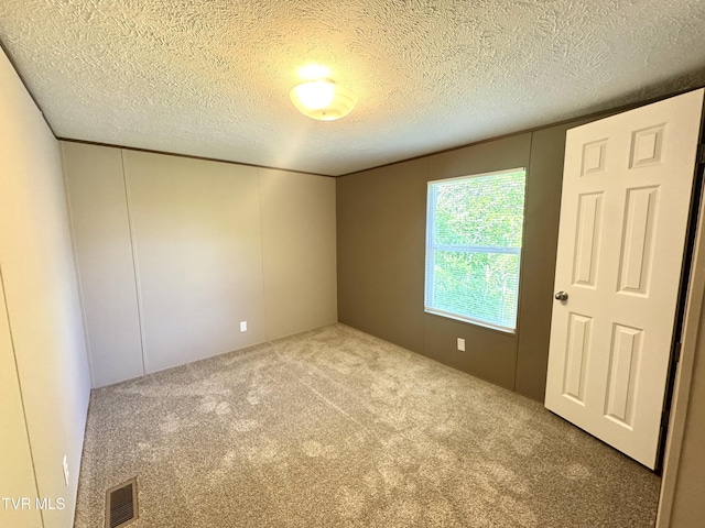 236 Redwood Dr, Raven, VA 24639 - unfurnished room featuring carpet, a textured ceiling, and visible vents