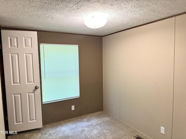 236 Redwood Dr, Raven, VA 24639 - carpeted empty room featuring crown molding and a textured ceiling
