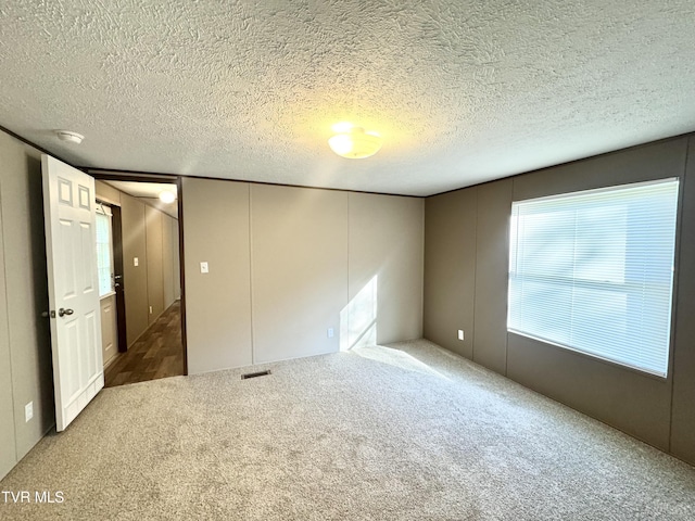 236 Redwood Dr, Raven, VA 24639 - unfurnished bedroom featuring carpet flooring and a textured ceiling