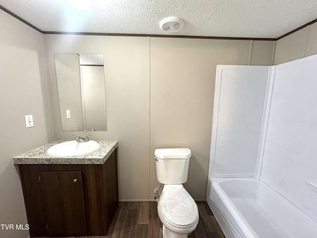 236 Redwood Dr, Raven, VA 24639 - bathroom with toilet, vanity, a textured ceiling, and wood finished floors