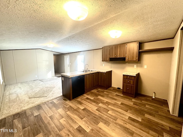 236 Redwood Dr, Raven, VA 24639 - kitchen featuring a peninsula, a sink, black dishwasher, dark wood-style flooring, and light countertops
