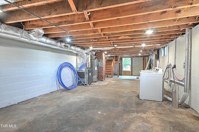 basement with water heater, stairway, and washer / clothes dryer
