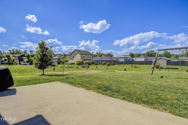 view of yard featuring a residential view and a patio area