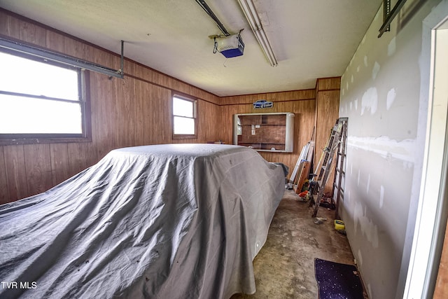 132 Hankal Rd, Gray, TN 37615 - bedroom featuring wood walls and concrete flooring