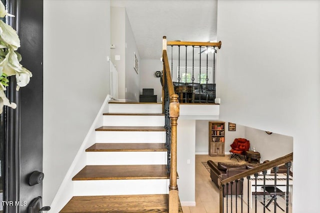 stairway featuring baseboards