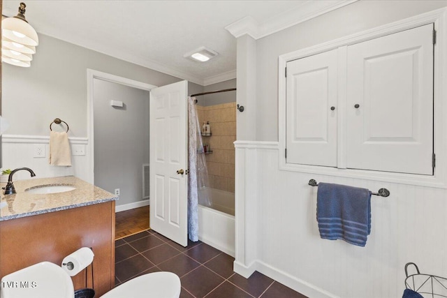 full bath featuring toilet, vanity, shower / tub combo with curtain, crown molding, and tile patterned flooring