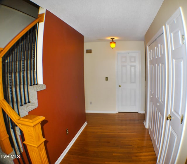 2700 Indian Ridge Rd Unit 23, Johnson City, TN 37604 - hall featuring wood finished floors, baseboards, and a textured ceiling