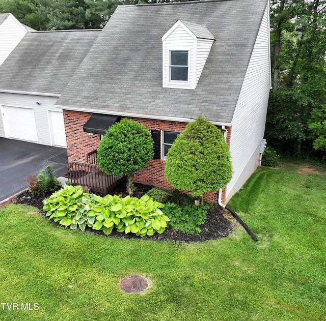 2700 Indian Ridge Rd Unit 23, Johnson City, TN 37604 - cape cod-style house with brick siding, a front lawn, a garage, and driveway