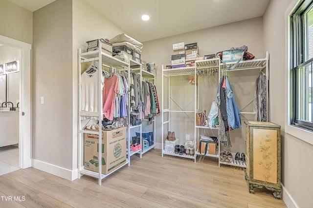 walk in closet featuring wood finished floors