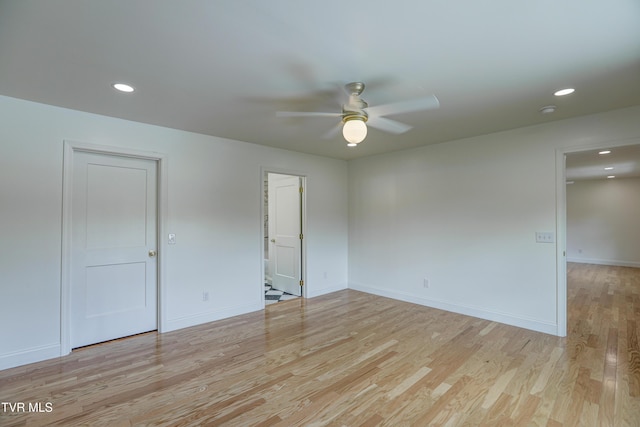 empty room with a ceiling fan, baseboards, light wood-style flooring, and recessed lighting