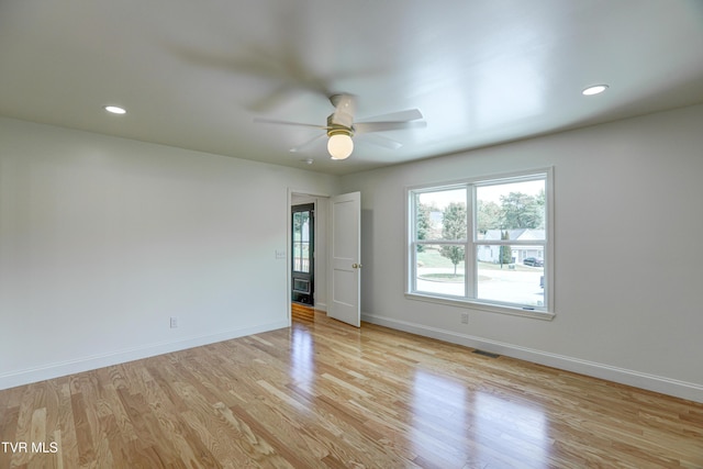 spare room featuring light wood finished floors, visible vents, baseboards, ceiling fan, and recessed lighting