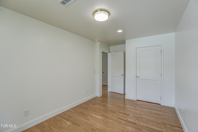 unfurnished bedroom with recessed lighting, baseboards, visible vents, and light wood-style floors