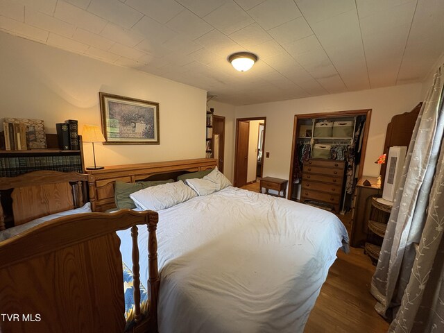 211 Arthur G Caudill Rd, West Jefferson, NC 28694 - bedroom featuring a closet, wood finished floors, and a walk in closet