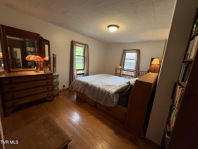 211 Arthur G Caudill Rd, West Jefferson, NC 28694 - bedroom featuring multiple windows and wood finished floors