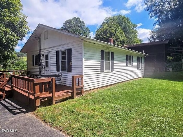 211 Arthur G Caudill Rd, West Jefferson, NC 28694 - view of property exterior featuring a deck and a yard