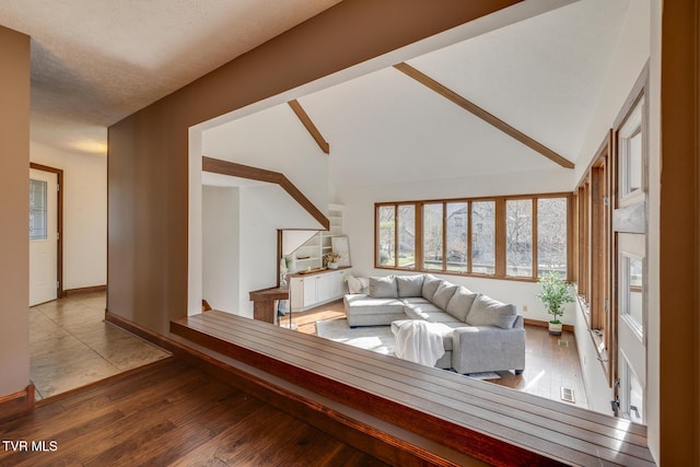 living room featuring baseboards and wood finished floors