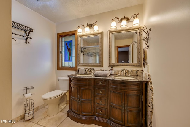 bathroom featuring toilet, a textured ceiling, walk in shower, and a sink