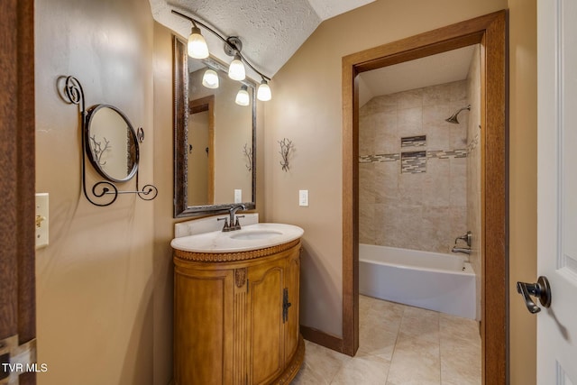 bathroom featuring tile patterned floors, a textured ceiling, vanity, lofted ceiling, and shower / bathtub combination