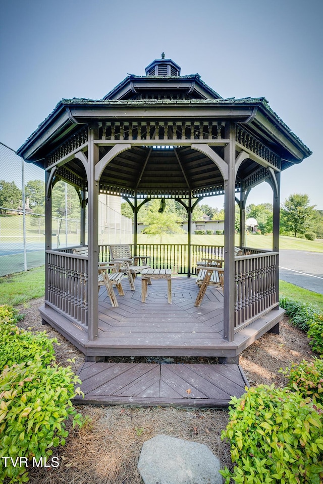deck with a gazebo and fence