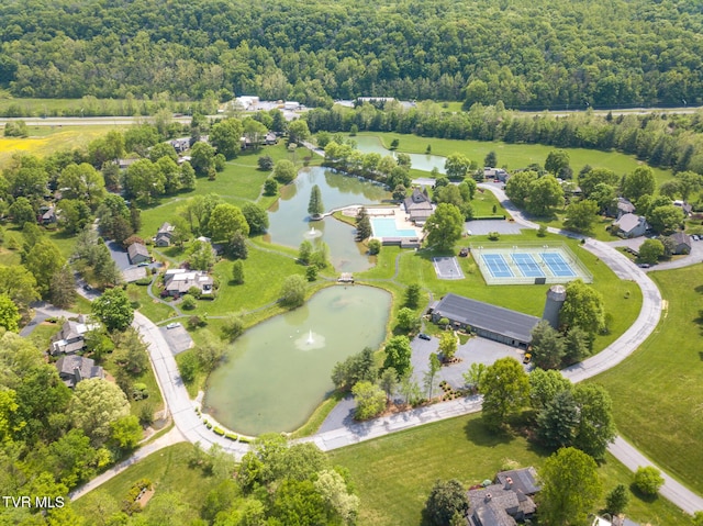 aerial view featuring a water view and a view of trees