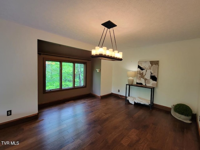 137 Columbine Rd, Kingsport, TN 37660 - unfurnished dining area with dark wood-style floors, baseboards, and a chandelier