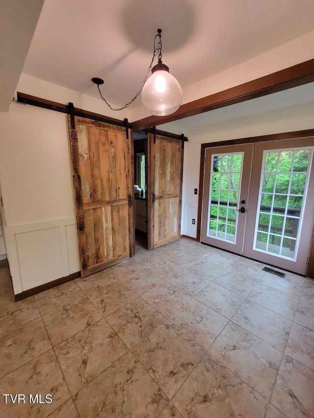137 Columbine Rd, Kingsport, TN 37660 - empty room featuring a barn door and french doors