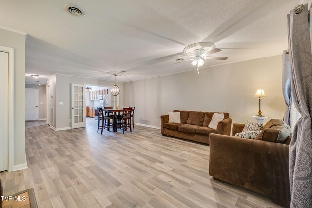 1127 Timbers E ., Unit Greeneville, TN 37745 - living room with light wood-style floors, ceiling fan, and baseboards