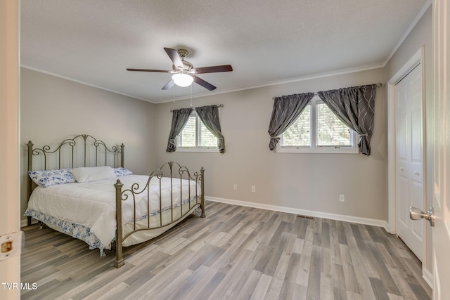 1127 Timbers E ., Unit Greeneville, TN 37745 - bedroom featuring wood finished floors, baseboards, crown molding, a textured ceiling, and a ceiling fan