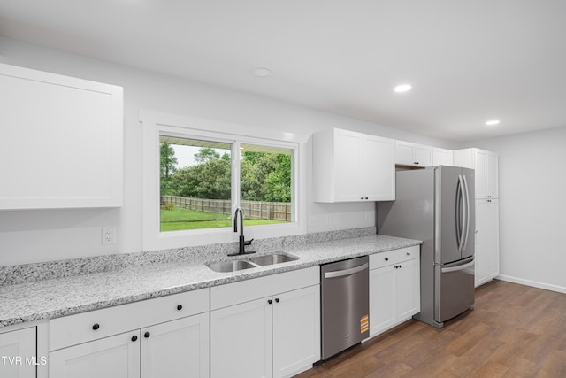 2503 Buffalo Rd, Johnson City, TN 37604 - kitchen featuring appliances with stainless steel finishes, a sink, white cabinets, dark wood-style floors, and recessed lighting