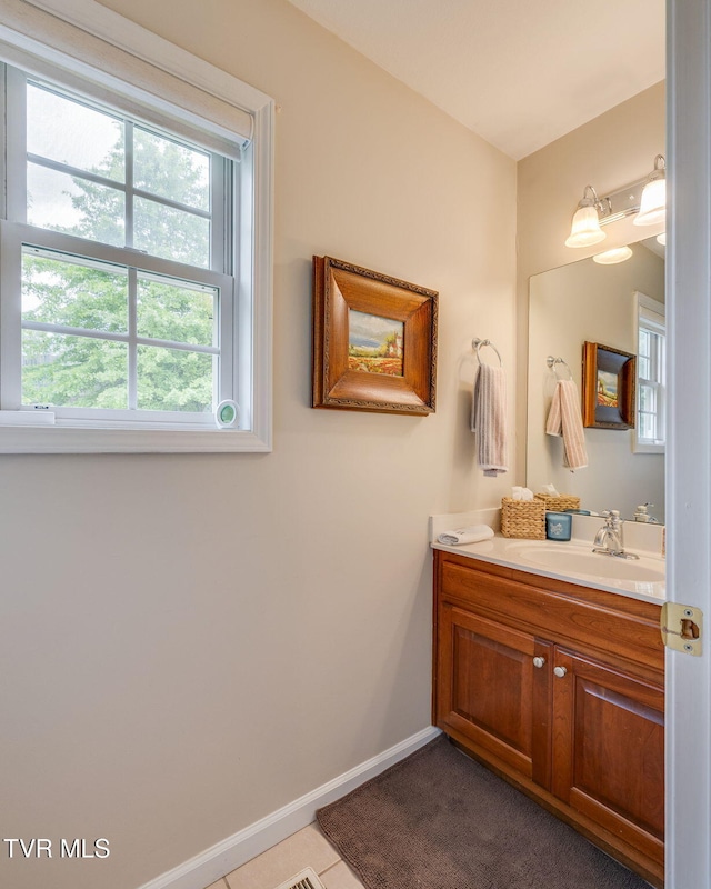 bathroom featuring vanity and baseboards