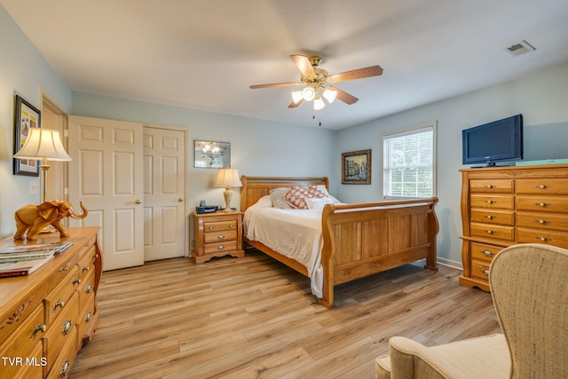 bedroom with light wood-type flooring and ceiling fan