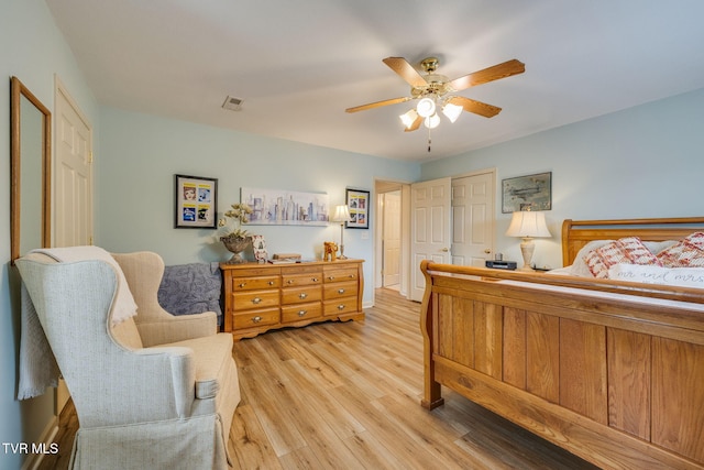 bedroom with light wood-style floors and ceiling fan