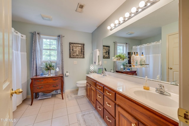 full bath with plenty of natural light, baseboards, tile patterned floors, and toilet