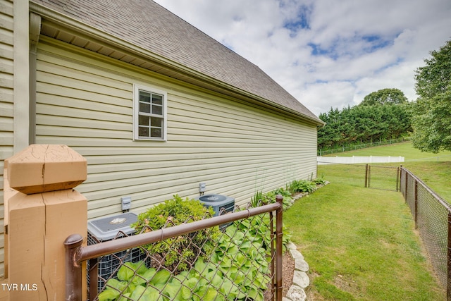view of property exterior featuring roof with shingles