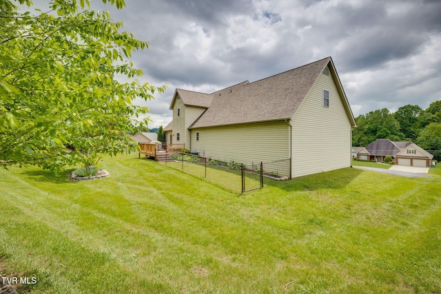 rear view of property with a shingled roof