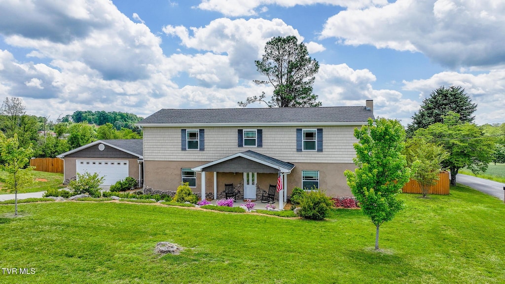 205 Hamilton Trl, Piney Flats, TN 37686 - view of front of property featuring a garage and stucco siding