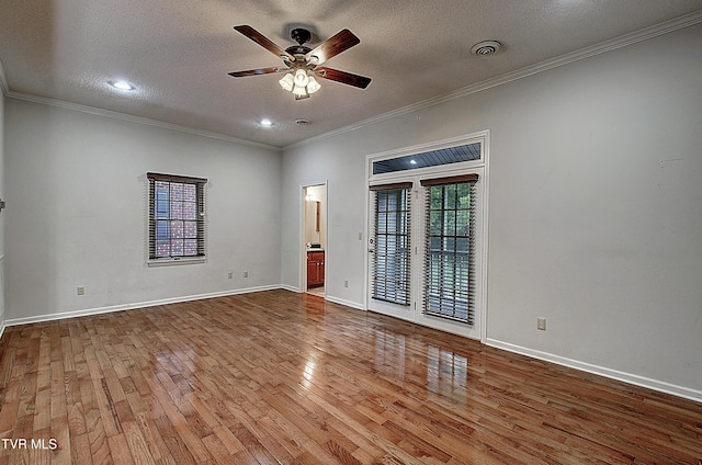 33 Oak Leaf Cir Unit 33, Johnson City, TN 37601 - empty room with wood finished floors, ceiling fan, a textured ceiling, ornamental molding, and baseboards