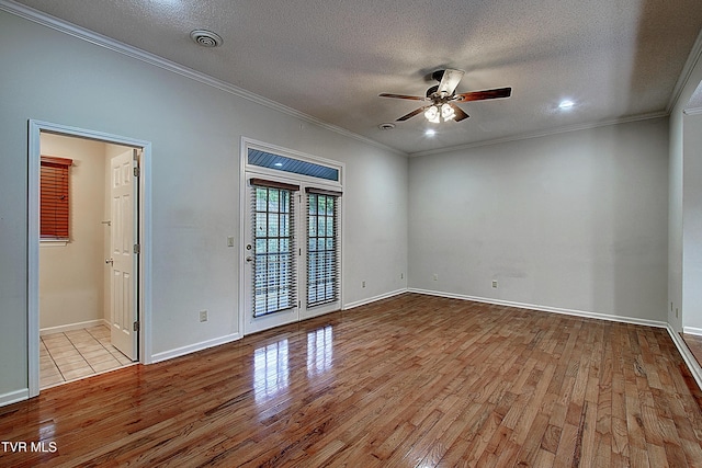33 Oak Leaf Cir Unit 33, Johnson City, TN 37601 - unfurnished room with wood finished floors, a ceiling fan, crown molding, a textured ceiling, and baseboards