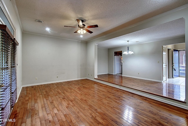 33 Oak Leaf Cir Unit 33, Johnson City, TN 37601 - empty room with a ceiling fan, a textured ceiling, a chandelier, hardwood / wood-style flooring, and ornamental molding