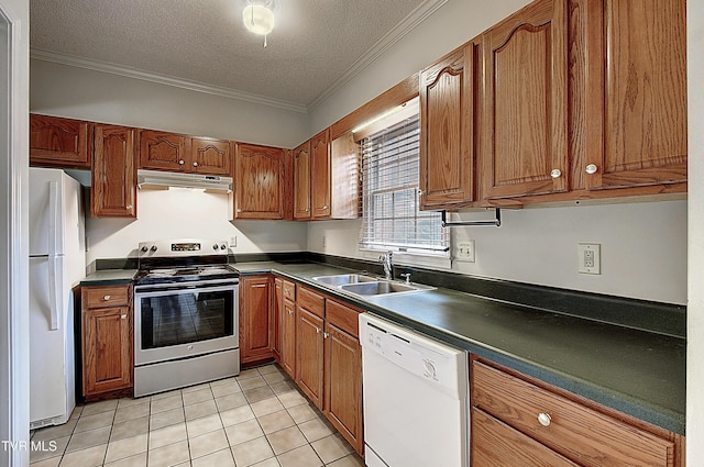 33 Oak Leaf Cir Unit 33, Johnson City, TN 37601 - kitchen featuring white appliances, under cabinet range hood, brown cabinets, dark countertops, and a sink