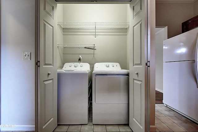 33 Oak Leaf Cir Unit 33, Johnson City, TN 37601 - laundry area featuring washer and dryer and light tile patterned floors