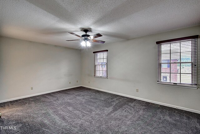 33 Oak Leaf Cir Unit 33, Johnson City, TN 37601 - empty room with a ceiling fan, dark carpet, baseboards, and a textured ceiling