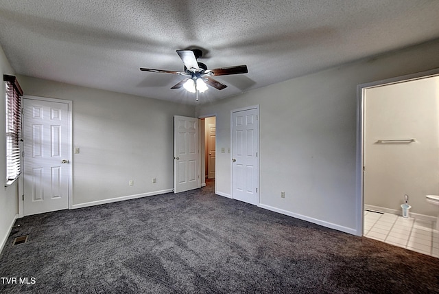 33 Oak Leaf Cir Unit 33, Johnson City, TN 37601 - unfurnished bedroom featuring dark carpet, baseboards, a textured ceiling, ceiling fan, and ensuite bath