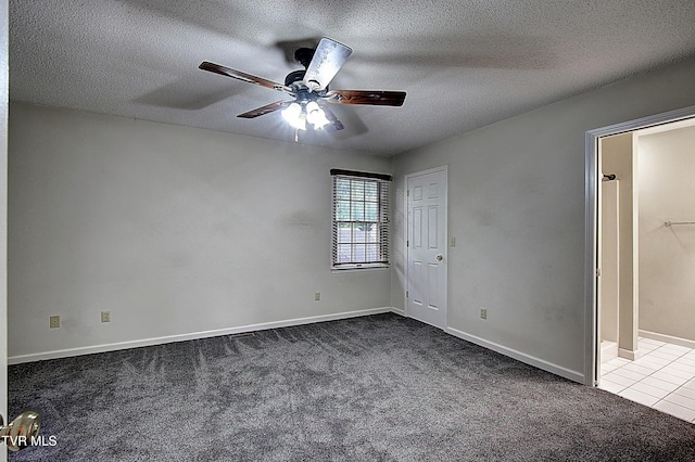 33 Oak Leaf Cir Unit 33, Johnson City, TN 37601 - unfurnished bedroom with carpet flooring, a textured ceiling, ceiling fan, baseboards, and tile patterned flooring