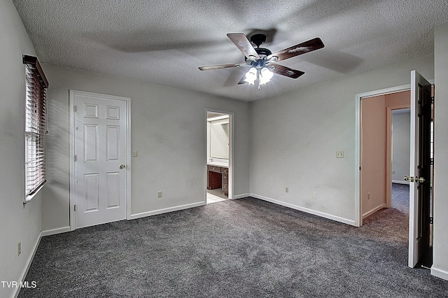 33 Oak Leaf Cir Unit 33, Johnson City, TN 37601 - unfurnished bedroom featuring dark carpet, a textured ceiling, baseboards, and ceiling fan