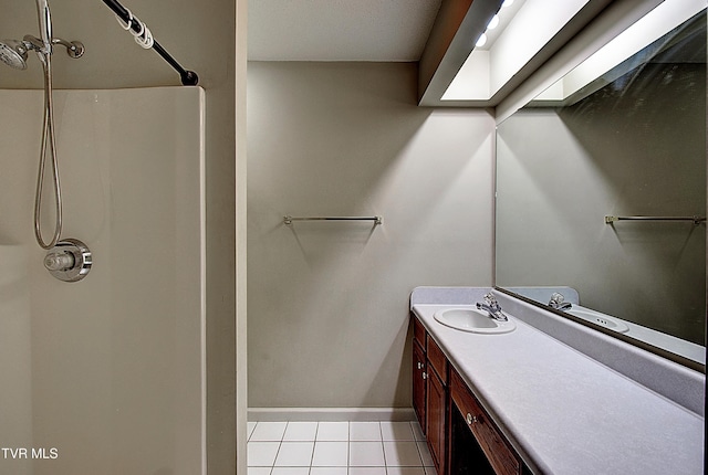 33 Oak Leaf Cir Unit 33, Johnson City, TN 37601 - bathroom with vanity, tile patterned flooring, a shower, and baseboards
