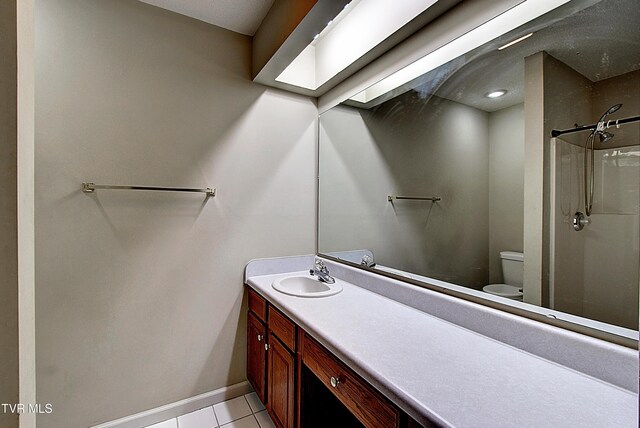 33 Oak Leaf Cir Unit 33, Johnson City, TN 37601 - bathroom with toilet, vanity, a shower, baseboards, and tile patterned floors