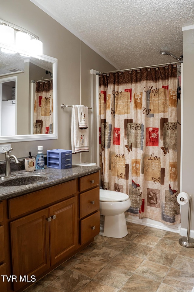 full bathroom with a shower with curtain, vanity, toilet, and a textured ceiling