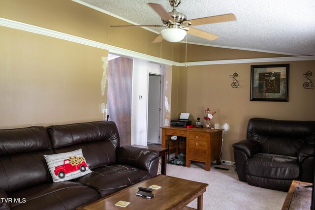 living room with lofted ceiling, a textured ceiling, ceiling fan, and light colored carpet